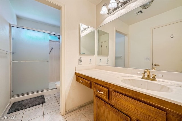 9024 Starmount Dr, Las Vegas, NV 89134 - bathroom with toilet, vanity, a stall shower, and tile patterned flooring