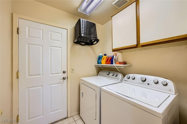 9024 Starmount Dr, Las Vegas, NV 89134 - laundry room featuring separate washer and dryer, light tile patterned flooring, and cabinet space