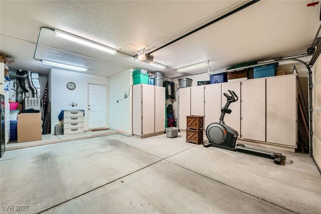 9024 Starmount Dr, Las Vegas, NV 89134 - garage featuring a garage door opener and heating unit