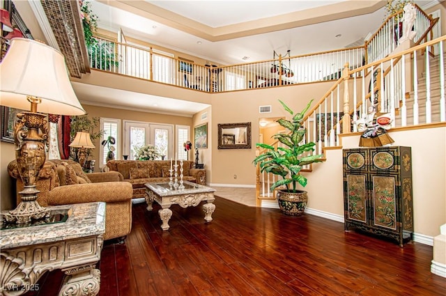 10798 Tapestry Winds St, Las Vegas, NV 89141 - living room with baseboards, hardwood / wood-style flooring, stairs, and ornamental molding