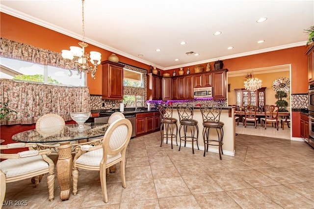 10798 Tapestry Winds St, Las Vegas, NV 89141 - dining area with a chandelier, recessed lighting, crown molding, and light tile patterned flooring