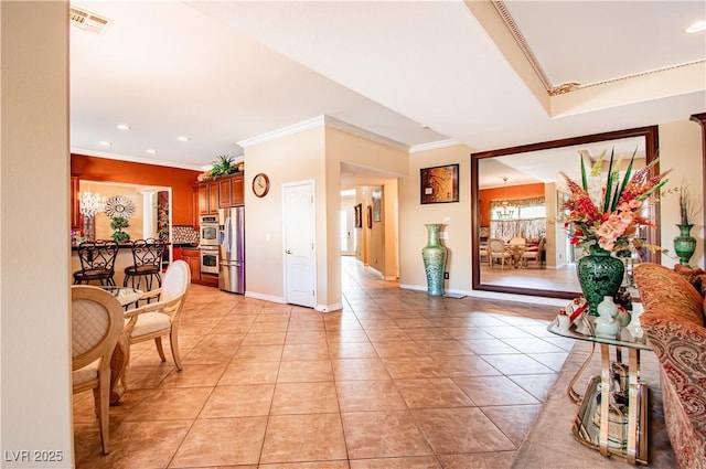 10798 Tapestry Winds St, Las Vegas, NV 89141 - entryway featuring crown molding, light tile patterned flooring, recessed lighting, and baseboards