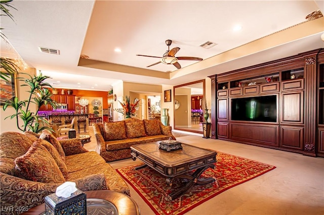 10798 Tapestry Winds St, Las Vegas, NV 89141 - living room with light carpet, a ceiling fan, a raised ceiling, and recessed lighting