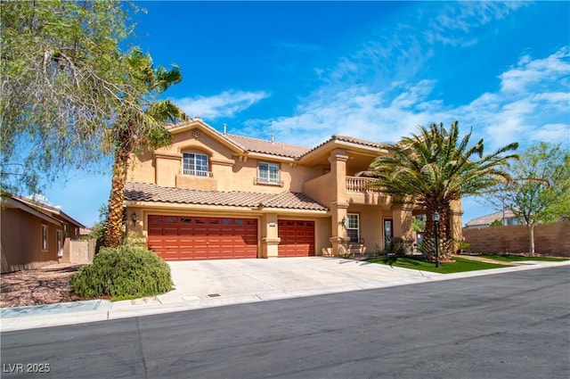 10798 Tapestry Winds St, Las Vegas, NV 89141 - mediterranean / spanish house with stucco siding, a tile roof, concrete driveway, a balcony, and a garage