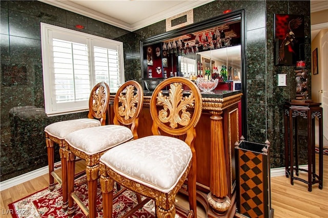 10798 Tapestry Winds St, Las Vegas, NV 89141 - indoor dry bar featuring ornamental molding and wood finished floors