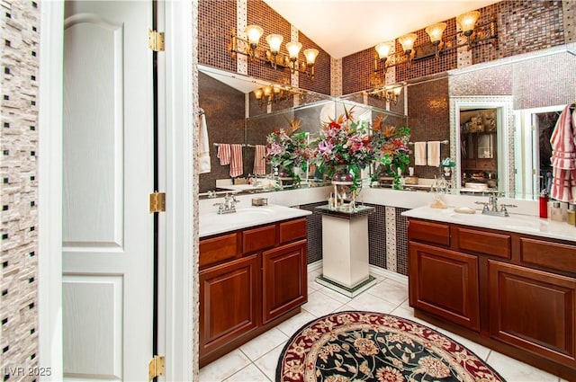 10798 Tapestry Winds St, Las Vegas, NV 89141 - full bath featuring a chandelier, tile patterned flooring, two vanities, and vaulted ceiling