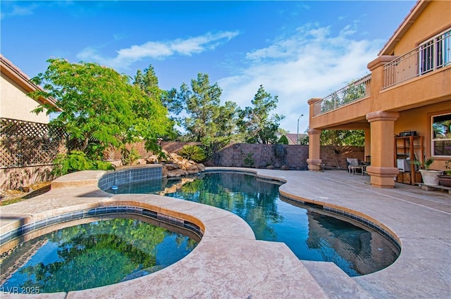 10798 Tapestry Winds St, Las Vegas, NV 89141 - view of pool featuring an in-ground hot tub, a patio area, and a fenced backyard
