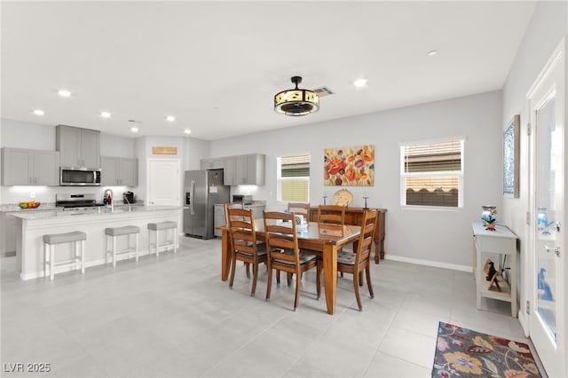 10951 Stone Crossing Ave, Las Vegas, NV 89166 - dining room featuring healthy amount of natural light, recessed lighting, baseboards, and light tile patterned floors
