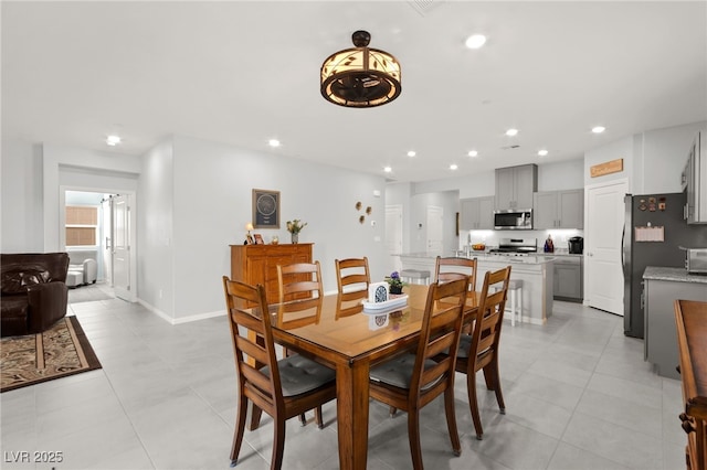 10951 Stone Crossing Ave, Las Vegas, NV 89166 - dining area featuring recessed lighting, light tile patterned flooring, and baseboards