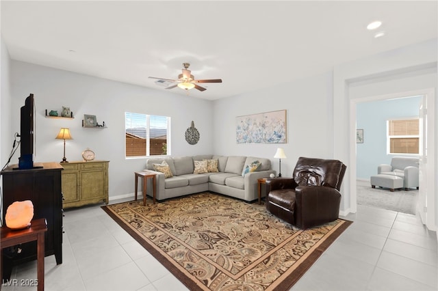 10951 Stone Crossing Ave, Las Vegas, NV 89166 - living area with a ceiling fan, light tile patterned floors, and baseboards