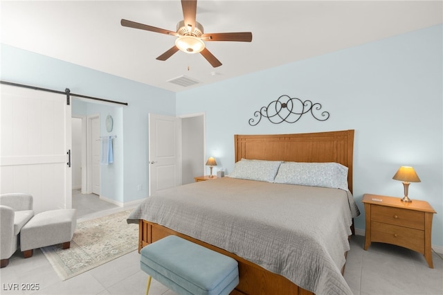 10951 Stone Crossing Ave, Las Vegas, NV 89166 - bedroom with a barn door, light tile patterned flooring, ceiling fan, and baseboards