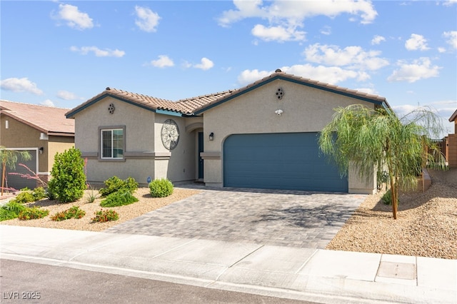 10951 Stone Crossing Ave, Las Vegas, NV 89166 - mediterranean / spanish-style home with a tile roof, decorative driveway, stucco siding, and a garage