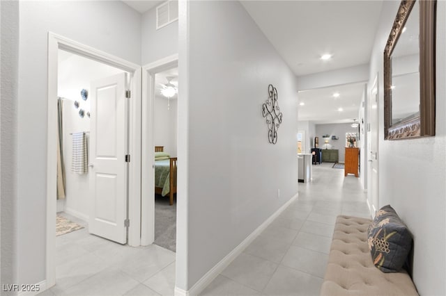 10951 Stone Crossing Ave, Las Vegas, NV 89166 - hall featuring light tile patterned floors, recessed lighting, and baseboards
