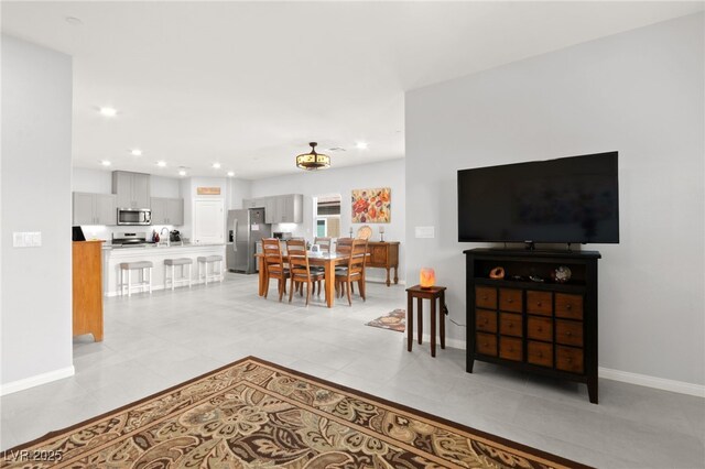 10951 Stone Crossing Ave, Las Vegas, NV 89166 - living room with baseboards, light tile patterned floors, and recessed lighting