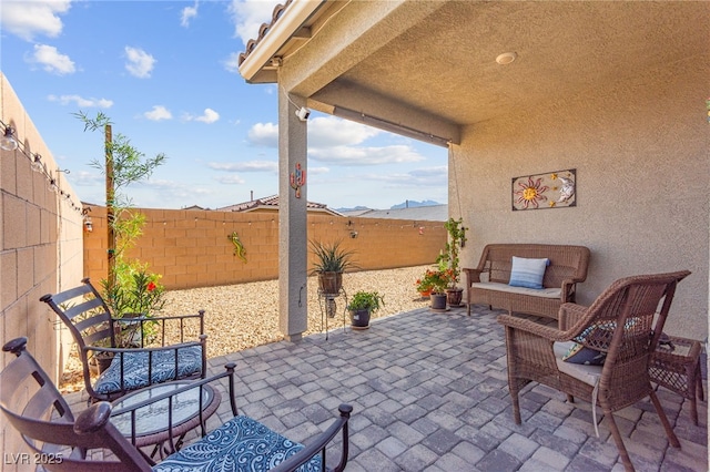 10951 Stone Crossing Ave, Las Vegas, NV 89166 - fenced backyard featuring a patio area