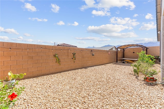 10951 Stone Crossing Ave, Las Vegas, NV 89166 - fenced backyard featuring a mountain view
