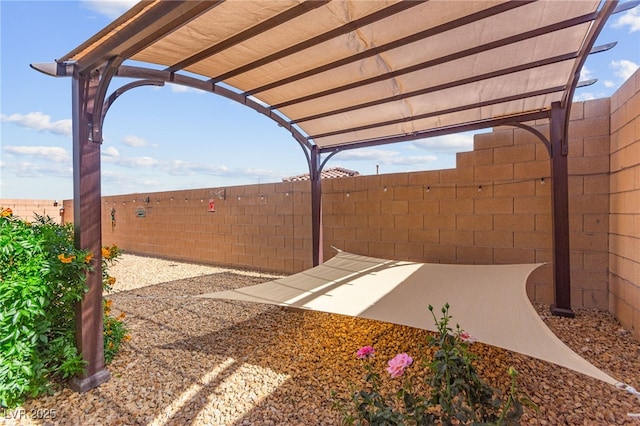 10951 Stone Crossing Ave, Las Vegas, NV 89166 - fenced backyard featuring a pergola