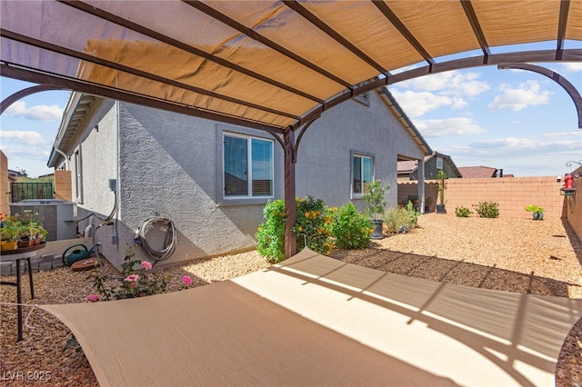 10951 Stone Crossing Ave, Las Vegas, NV 89166 - fenced backyard featuring cooling unit, a patio, and a pergola