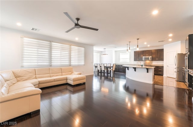 10315 Turia Gardens Rd, Las Vegas, NV 89135 - living room with ceiling fan, recessed lighting, and dark wood-style flooring