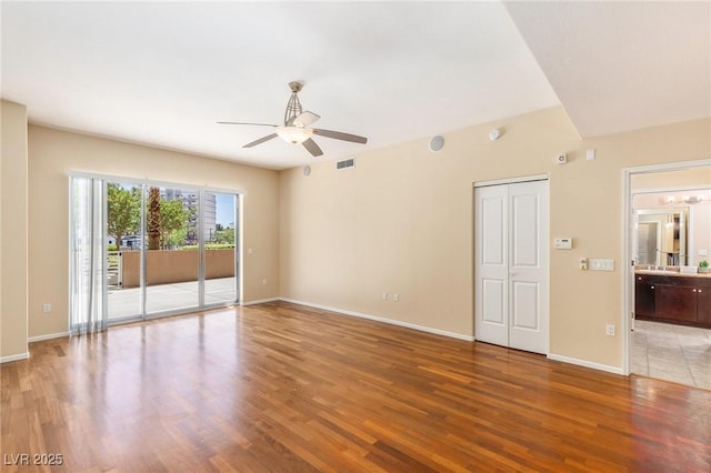 8255 Las Vegas Blvd Unit 117, Las Vegas, NV 89123 - spare room with a ceiling fan, wood finished floors, and baseboards