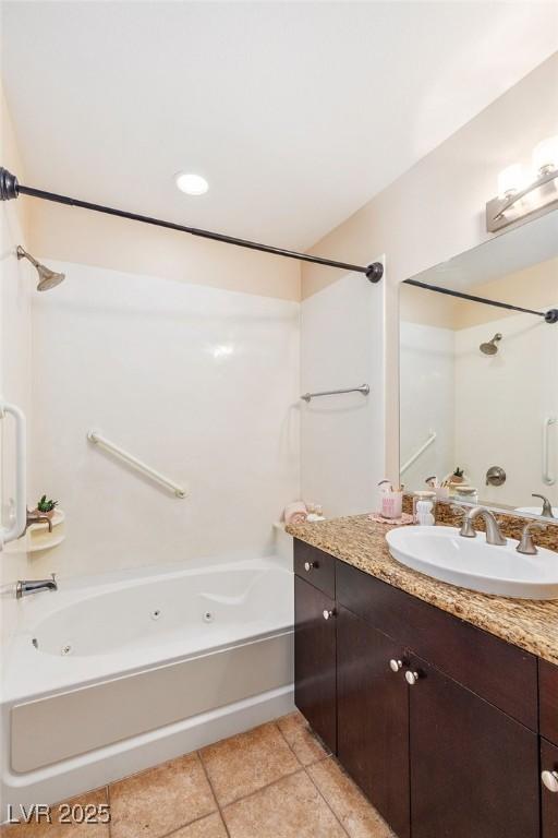 8255 Las Vegas Blvd Unit 117, Las Vegas, NV 89123 - full bathroom with a combined bath / shower with jetted tub, tile patterned floors, and vanity