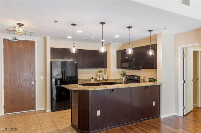 8255 Las Vegas Blvd Unit 117, Las Vegas, NV 89123 - kitchen featuring black appliances, a peninsula, baseboards, dark brown cabinets, and recessed lighting