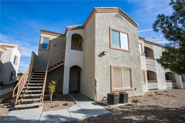 4655 Gold Dust Ave Unit 206, Las Vegas, NV 89120 - view of building exterior featuring stairway and central air condition unit