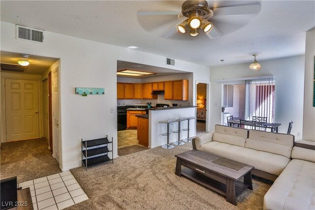 4655 Gold Dust Ave Unit 206, Las Vegas, NV 89120 - carpeted living room featuring a ceiling fan and tile patterned flooring