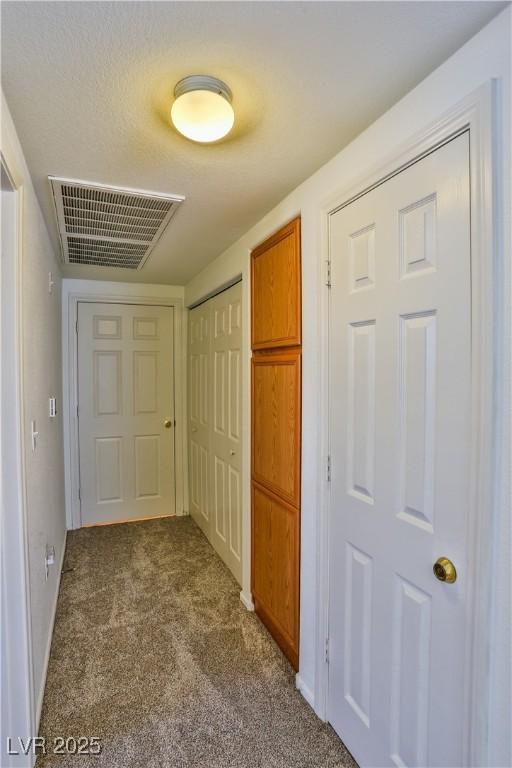 4655 Gold Dust Ave Unit 206, Las Vegas, NV 89120 - corridor with dark colored carpet and baseboards