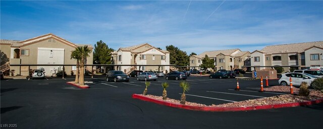 4655 Gold Dust Ave Unit 206, Las Vegas, NV 89120 - uncovered parking lot featuring a residential view