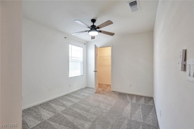 5398 Robinera Ct, Las Vegas, NV 89166 - unfurnished room with ceiling fan, carpet flooring, and baseboards