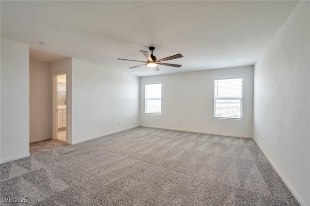 5398 Robinera Ct, Las Vegas, NV 89166 - spare room with a ceiling fan, light colored carpet, and baseboards