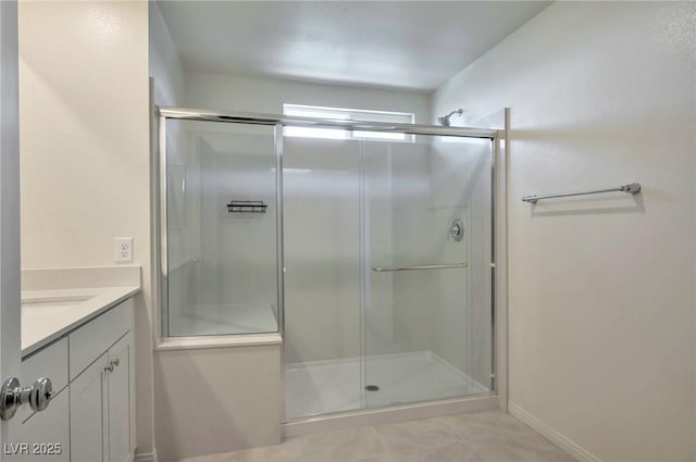 5398 Robinera Ct, Las Vegas, NV 89166 - bathroom with a shower stall, vanity, and tile patterned flooring
