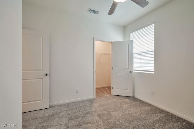 5398 Robinera Ct, Las Vegas, NV 89166 - unfurnished bedroom with carpet, a spacious closet, baseboards, and a closet
