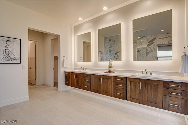 10228 Shell Star Ave, Las Vegas, NV 89135 - bathroom with double vanity, tile patterned flooring, baseboards, recessed lighting, and a shower
