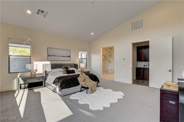 10228 Shell Star Ave, Las Vegas, NV 89135 - carpeted bedroom featuring connected bathroom, baseboards, recessed lighting, and high vaulted ceiling