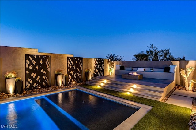 10228 Shell Star Ave, Las Vegas, NV 89135 - view of swimming pool featuring an outdoor fire pit