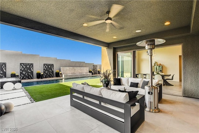 10228 Shell Star Ave, Las Vegas, NV 89135 - view of patio with a ceiling fan, an outdoor hangout area, and an outdoor pool