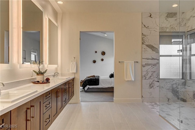 10228 Shell Star Ave, Las Vegas, NV 89135 - ensuite bathroom featuring a marble finish shower, double vanity, recessed lighting, and baseboards