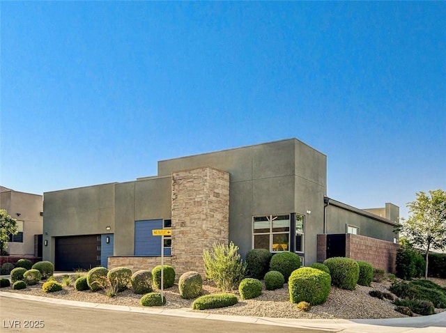 10228 Shell Star Ave, Las Vegas, NV 89135 - view of front of house featuring stucco siding and an attached garage