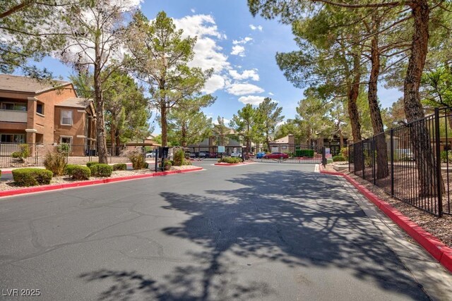 555 E Silverado Ranch Blvd Unit 2164, Las Vegas, NV 89183 - view of asphalt street featuring curbs, a residential view, and a gated entry