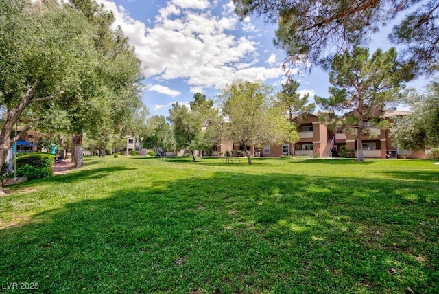 555 E Silverado Ranch Blvd Unit 2164, Las Vegas, NV 89183 - view of home's community featuring a lawn