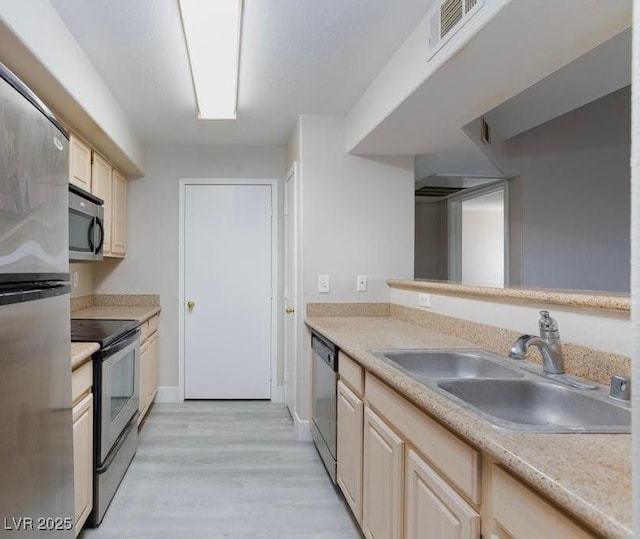 555 E Silverado Ranch Blvd Unit 2164, Las Vegas, NV 89183 - kitchen featuring appliances with stainless steel finishes, a sink, light countertops, and light wood-type flooring