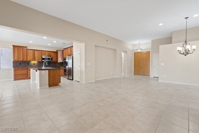 1008 New Creek Ave, Henderson, NV 89015 - unfurnished living room featuring a chandelier, a sink, recessed lighting, baseboards, and light tile patterned flooring