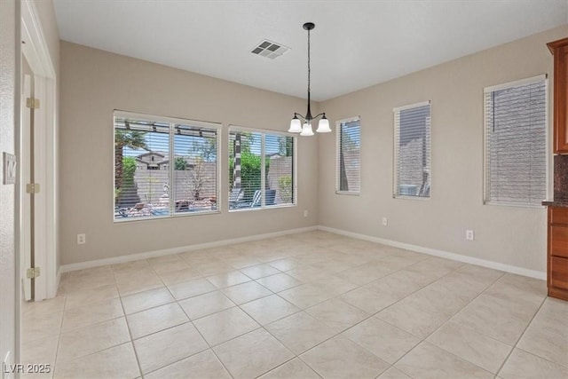 1008 New Creek Ave, Henderson, NV 89015 - unfurnished room featuring a chandelier, light tile patterned floors, and baseboards