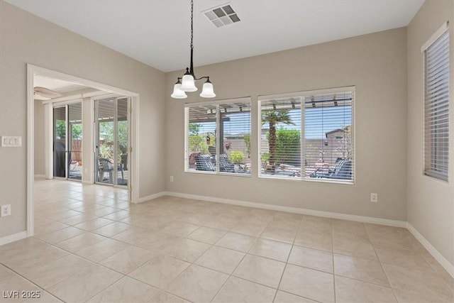 1008 New Creek Ave, Henderson, NV 89015 - empty room with light tile patterned flooring, a chandelier, and baseboards