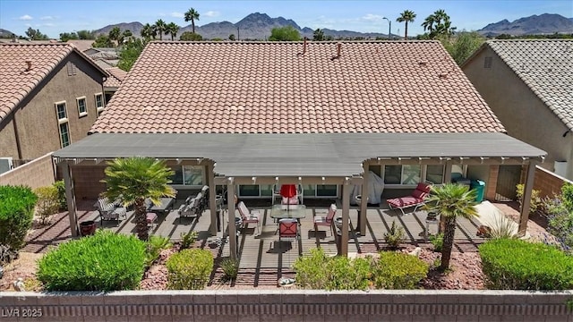 1008 New Creek Ave, Henderson, NV 89015 - rear view of house featuring a tile roof, a mountain view, a pergola, and a patio area