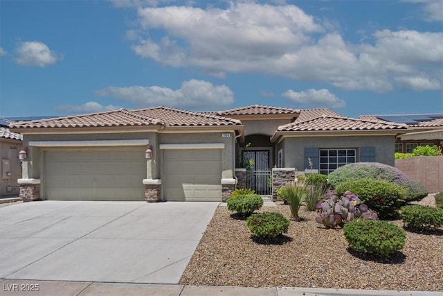 1008 New Creek Ave, Henderson, NV 89015 - mediterranean / spanish-style house with an attached garage, stucco siding, concrete driveway, stone siding, and a tile roof