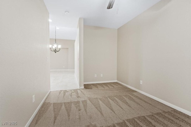 1008 New Creek Ave, Henderson, NV 89015 - empty room featuring carpet, a chandelier, and baseboards