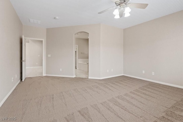 1008 New Creek Ave, Henderson, NV 89015 - unfurnished room featuring arched walkways, a ceiling fan, carpet, and baseboards